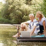 A recently retired couple enjoying their time on a dock